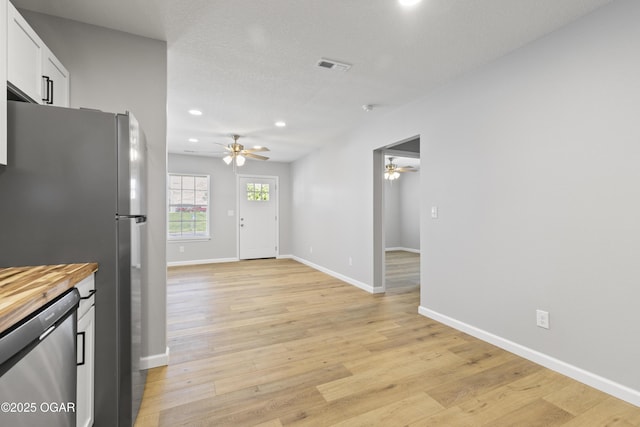 504 S Mckinley Ave, Joplin, MO 64801 - kitchen with a ceiling fan, appliances with stainless steel finishes, recessed lighting, white cabinetry, and baseboards