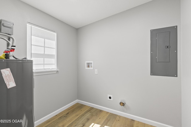504 S Mckinley Ave, Joplin, MO 64801 - washroom with electric panel, water heater, baseboards, light wood-style floors, and hookup for a washing machine