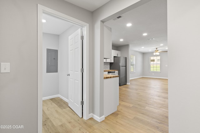 504 S Mckinley Ave, Joplin, MO 64801 - corridor featuring electric panel, light wood finished floors, baseboards, and recessed lighting