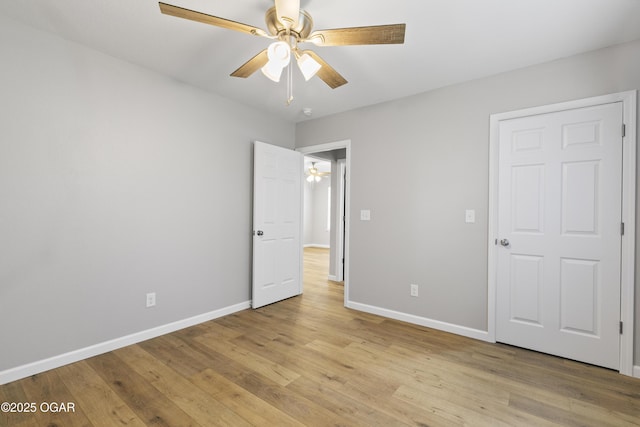 504 S Mckinley Ave, Joplin, MO 64801 - unfurnished bedroom with baseboards, light wood finished floors, and ceiling fan