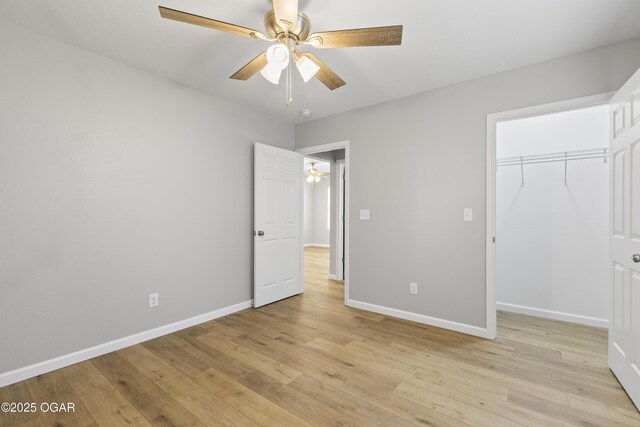 504 S Mckinley Ave, Joplin, MO 64801 - unfurnished bedroom featuring light wood-style floors, baseboards, a closet, and a ceiling fan