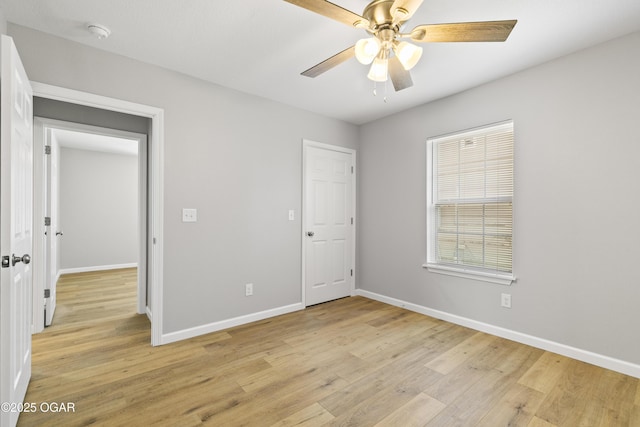 504 S Mckinley Ave, Joplin, MO 64801 - unfurnished bedroom with light wood-type flooring, baseboards, and ceiling fan