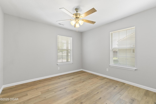 504 S Mckinley Ave, Joplin, MO 64801 - empty room featuring baseboards, light wood-style floors, and ceiling fan