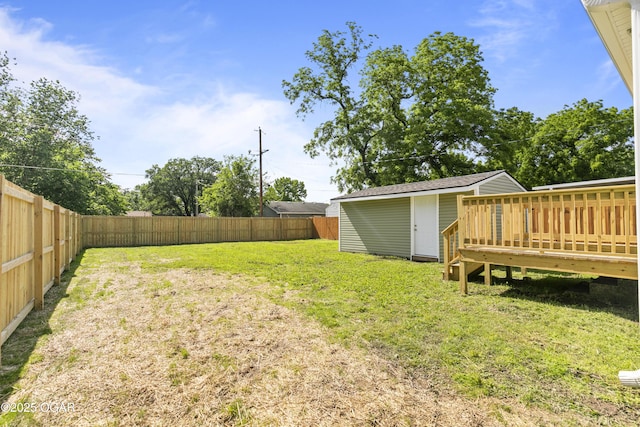 504 S Mckinley Ave, Joplin, MO 64801 - view of yard featuring a wooden deck and an outbuilding