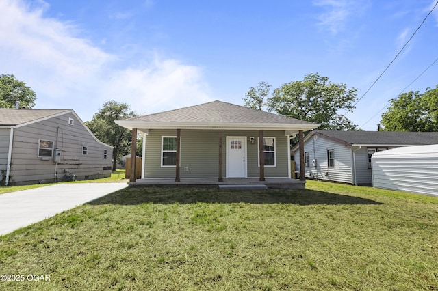504 S Mckinley Ave, Joplin, MO 64801 - view of front of property featuring a porch, a front yard, and roof with shingles