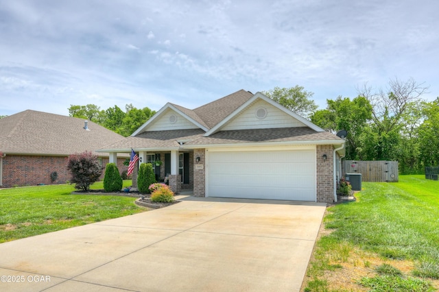 1692 Betenbough Way, Webb City, MO 64870 - view of front of home featuring central AC, an attached garage, driveway, roof with shingles, and brick siding