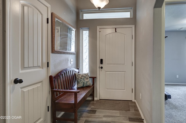 1692 Betenbough Way, Webb City, MO 64870 - entryway featuring arched walkways, baseboards, and wood finished floors