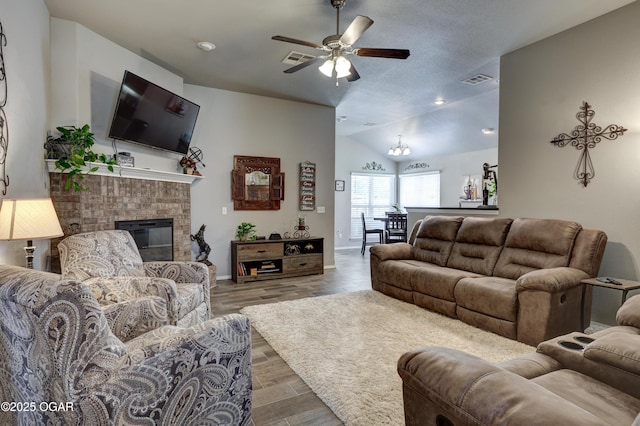 1692 Betenbough Way, Webb City, MO 64870 - living room featuring ceiling fan, vaulted ceiling, a fireplace, baseboards, and wood finished floors