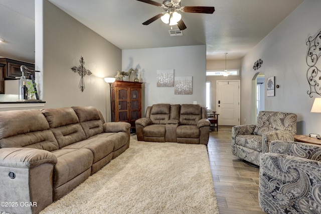 1692 Betenbough Way, Webb City, MO 64870 - living area with a ceiling fan, wood finished floors, and arched walkways