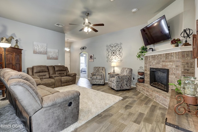 1692 Betenbough Way, Webb City, MO 64870 - living area featuring ceiling fan, wood finished floors, and a brick fireplace