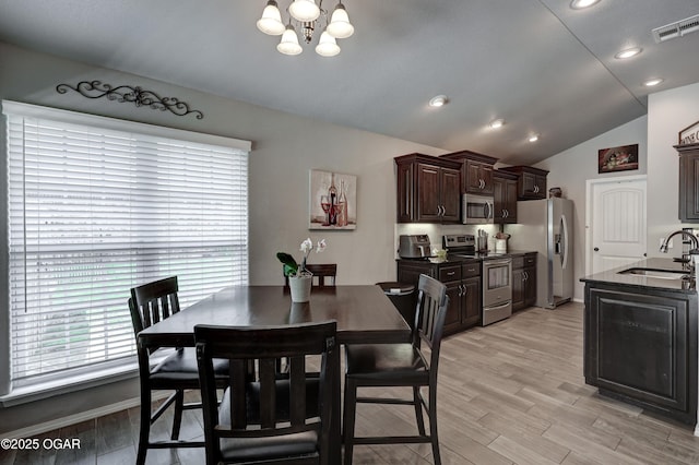 1692 Betenbough Way, Webb City, MO 64870 - dining area with lofted ceiling, a chandelier, light wood-type flooring, and recessed lighting