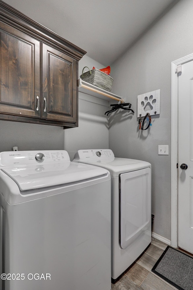 1692 Betenbough Way, Webb City, MO 64870 - washroom featuring independent washer and dryer, cabinet space, light wood-style flooring, and baseboards