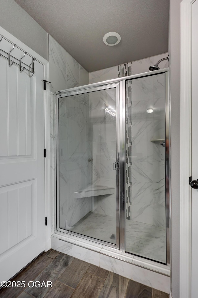 1692 Betenbough Way, Webb City, MO 64870 - full bath with a marble finish shower, wood finished floors, and a textured ceiling