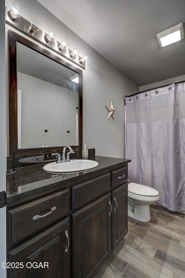 1692 Betenbough Way, Webb City, MO 64870 - full bath featuring vanity, toilet, a textured ceiling, wood finished floors, and curtained shower