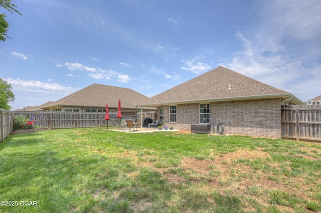 1692 Betenbough Way, Webb City, MO 64870 - rear view of house with a patio area, brick siding, and a shingled roof