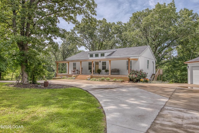 2010 Cherry St, Seneca, MO 64865 - view of front of property featuring covered porch, driveway, a front yard, and roof with shingles