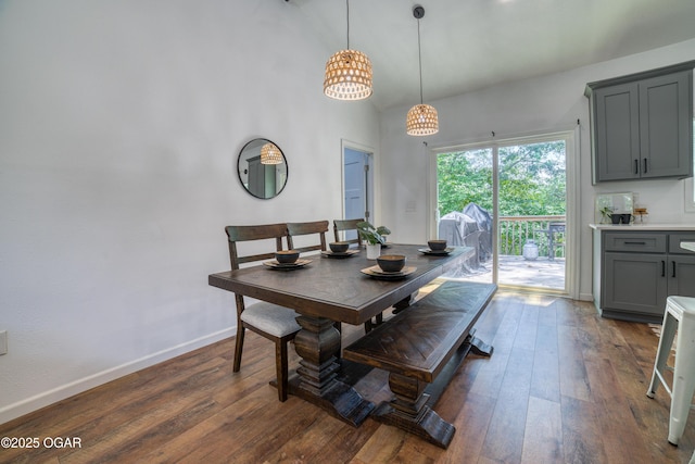 2010 Cherry St, Seneca, MO 64865 - dining room with dark wood finished floors, baseboards, a chandelier, and lofted ceiling