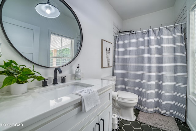 2010 Cherry St, Seneca, MO 64865 - full bathroom with toilet, vanity, tile patterned flooring, and a shower with curtain
