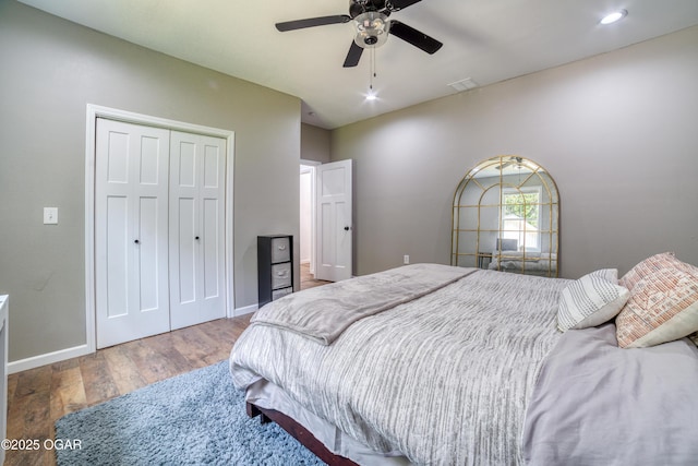 2010 Cherry St, Seneca, MO 64865 - bedroom featuring wood finished floors, a closet, baseboards, ceiling fan, and recessed lighting