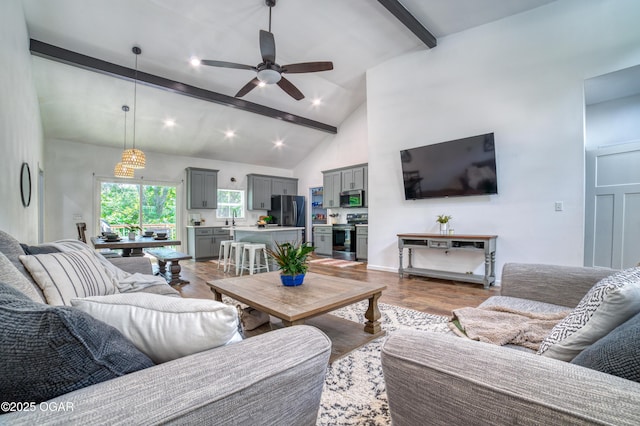 2010 Cherry St, Seneca, MO 64865 - living area featuring beamed ceiling, a ceiling fan, dark wood-style flooring, recessed lighting, and high vaulted ceiling