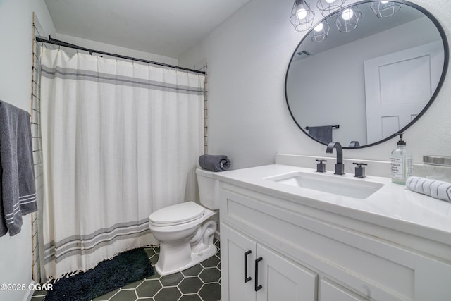 2010 Cherry St, Seneca, MO 64865 - full bath featuring vanity, toilet, tile patterned flooring, and a shower with shower curtain