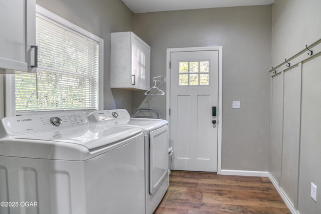 2010 Cherry St, Seneca, MO 64865 - washroom with cabinet space, wood finished floors, and washer and dryer