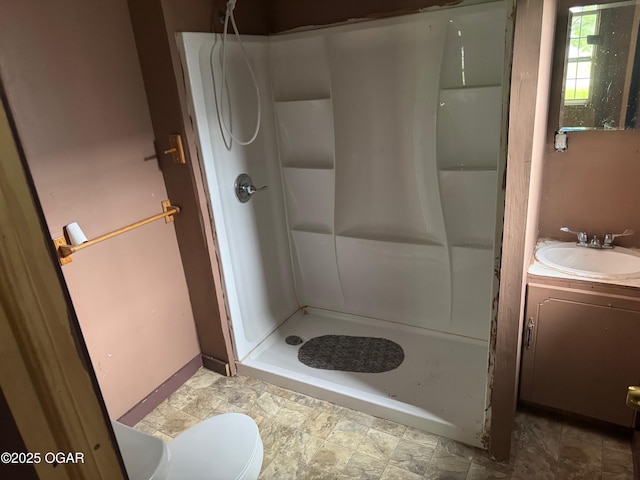 404 E 18th St, Baxter Springs, KS 66713 - bathroom featuring a stall shower, vanity, and toilet