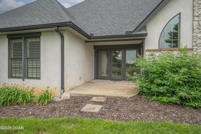 1704 Liam St, Carthage, MO 64836 - rear view of house featuring a shingled roof and stucco siding