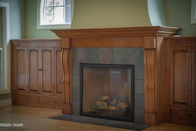 1704 Liam St, Carthage, MO 64836 - detailed view of a tile fireplace and wood finished floors