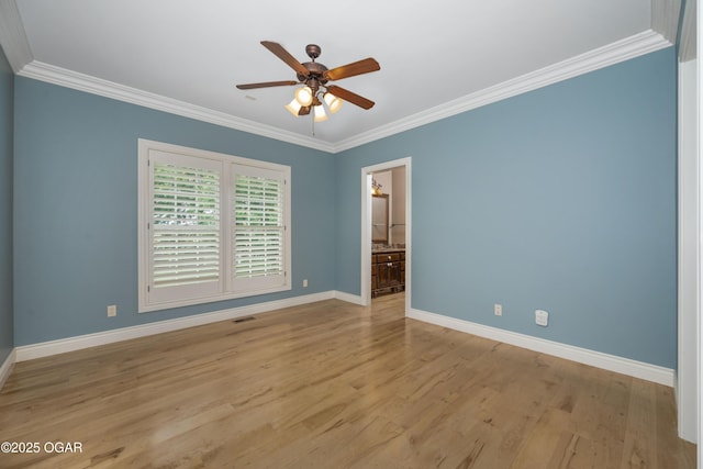 1704 Liam St, Carthage, MO 64836 - spare room featuring baseboards, crown molding, a ceiling fan, and light wood-style floors