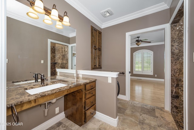 1704 Liam St, Carthage, MO 64836 - bathroom featuring a sink, ornamental molding, baseboards, and a ceiling fan