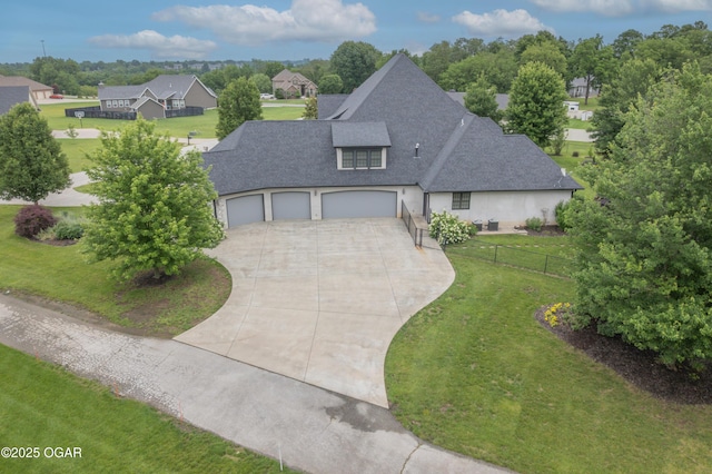 1704 Liam St, Carthage, MO 64836 - view of front of property with concrete driveway, a shingled roof, an attached garage, and a residential view