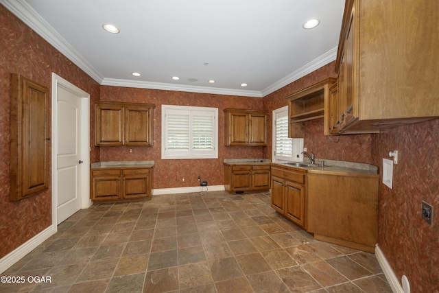 1704 Liam St, Carthage, MO 64836 - kitchen featuring a sink, brown cabinetry, open shelves, baseboards, and crown molding