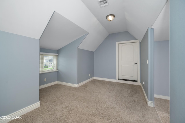 1704 Liam St, Carthage, MO 64836 - bonus room with carpet flooring, lofted ceiling, and baseboards