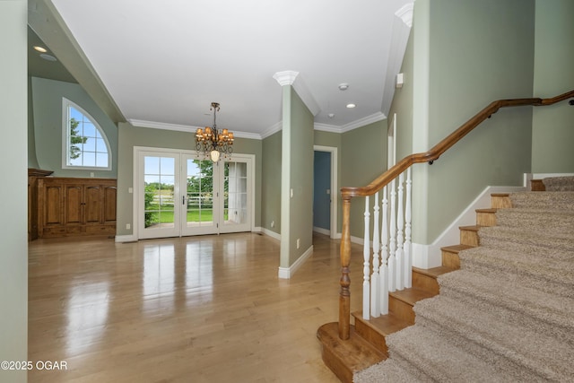 1704 Liam St, Carthage, MO 64836 - foyer with a chandelier, stairs, baseboards, light wood-style floors, and ornamental molding