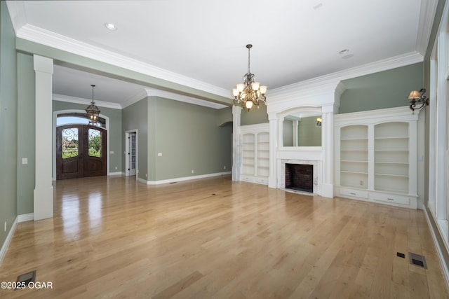 1704 Liam St, Carthage, MO 64836 - unfurnished living room with a chandelier, light wood-style flooring, baseboards, ornamental molding, and recessed lighting