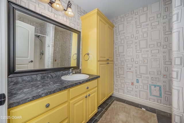 1704 Liam St, Carthage, MO 64836 - bathroom with wallpapered walls, baseboards, vanity, tile patterned flooring, and a shower