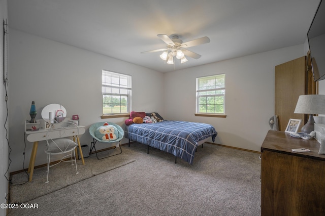 201 Canary Ln, Commerce, OK 74339 - bedroom with multiple windows, carpet flooring, baseboards, and a ceiling fan
