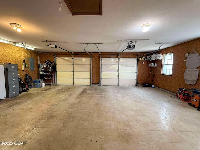 201 Canary Ln, Commerce, OK 74339 - garage with electric panel and a garage door opener