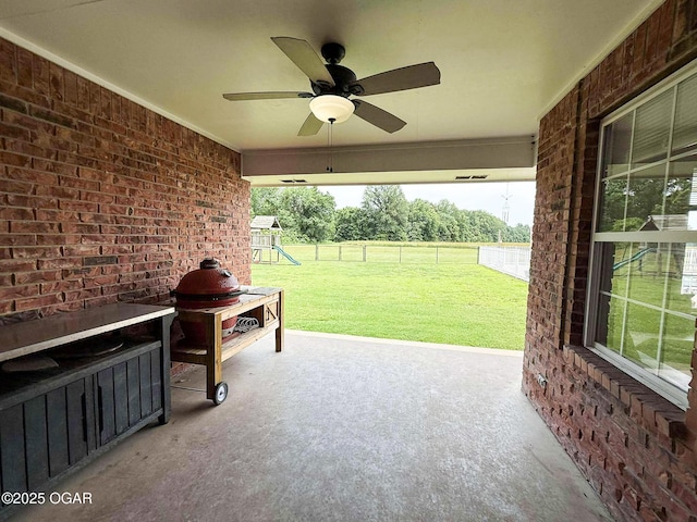 201 Canary Ln, Commerce, OK 74339 - view of patio / terrace featuring a playground and a ceiling fan