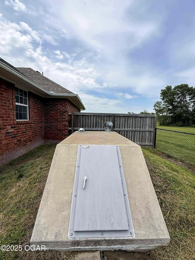 201 Canary Ln, Commerce, OK 74339 - entry to storm shelter