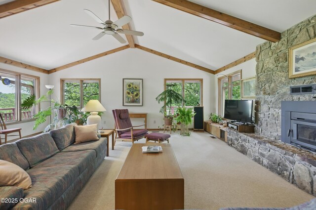 13495 Dogwood Rd, Carthage, MO 64836 - carpeted living area with ceiling fan and a stone fireplace