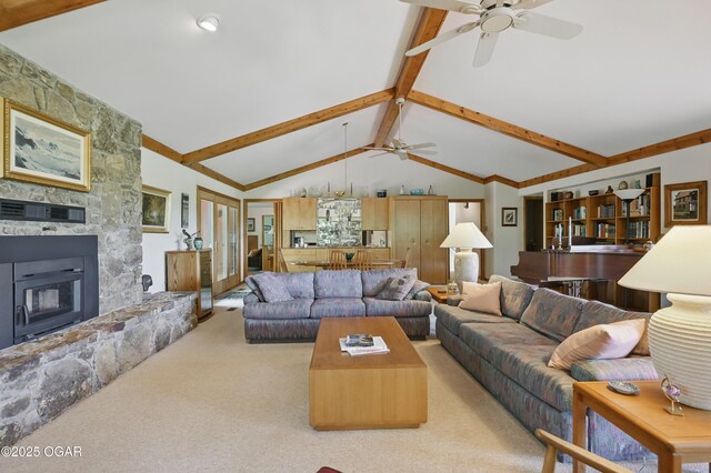 13495 Dogwood Rd, Carthage, MO 64836 - carpeted living room featuring ceiling fan and a stone fireplace