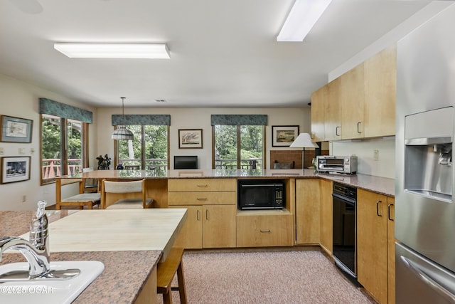 13495 Dogwood Rd, Carthage, MO 64836 - kitchen featuring stainless steel fridge with ice dispenser, black microwave, a peninsula, light brown cabinets, and hanging light fixtures