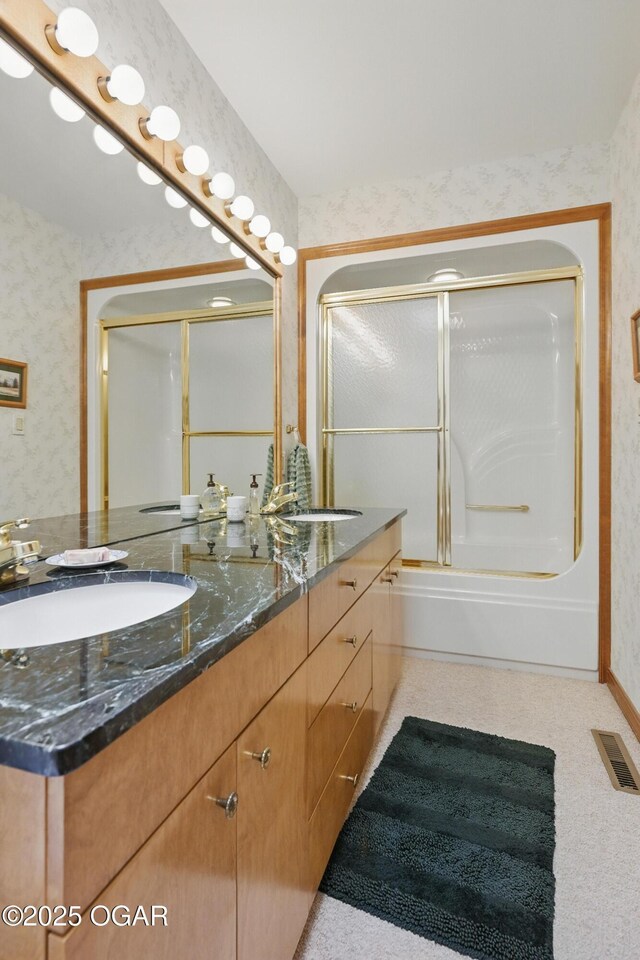 13495 Dogwood Rd, Carthage, MO 64836 - bathroom featuring double vanity, wallpapered walls, and enclosed tub / shower combo