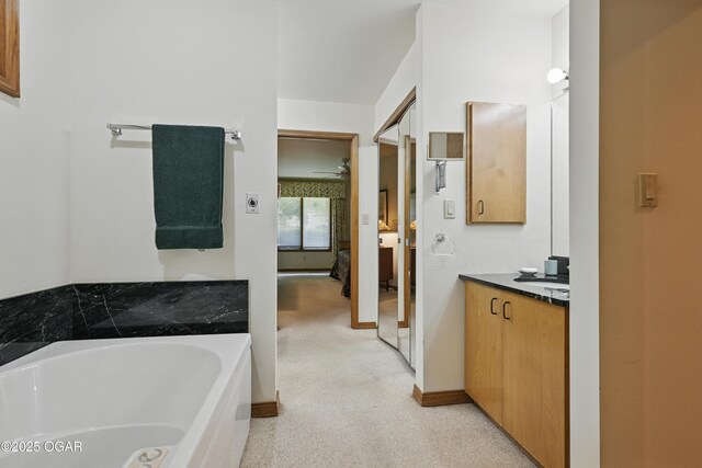 13495 Dogwood Rd, Carthage, MO 64836 - ensuite bathroom featuring vanity, a bath, and baseboards