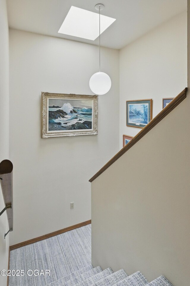 13495 Dogwood Rd, Carthage, MO 64836 - stairway with a skylight, baseboards, and carpet flooring