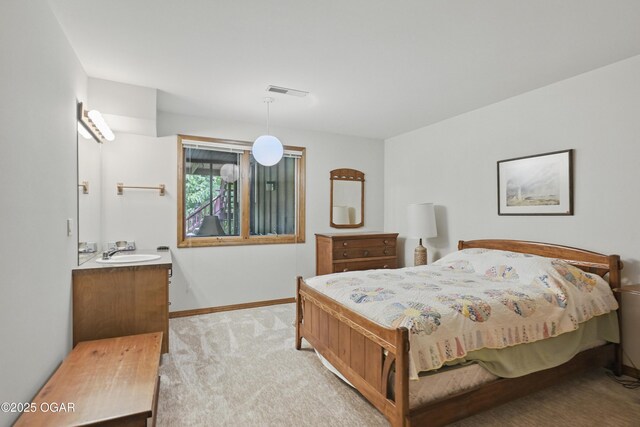 13495 Dogwood Rd, Carthage, MO 64836 - carpeted bedroom with a sink and baseboards