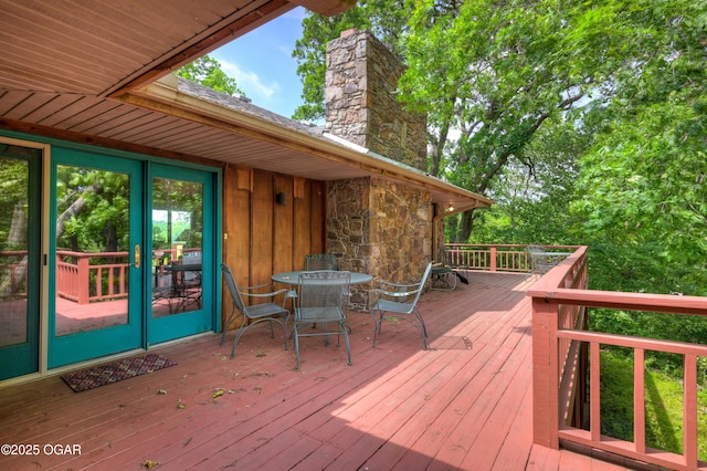 13495 Dogwood Rd, Carthage, MO 64836 - wooden deck with outdoor dining area
