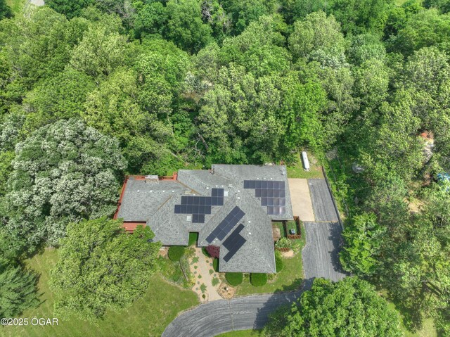 13495 Dogwood Rd, Carthage, MO 64836 - aerial view of property and surrounding area with a heavily wooded area